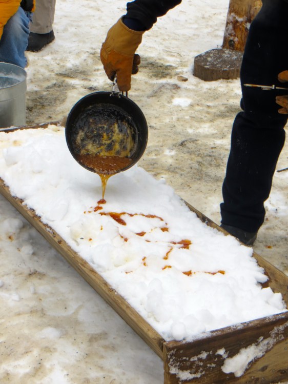 Pouring the hot syrup onto fresh snow