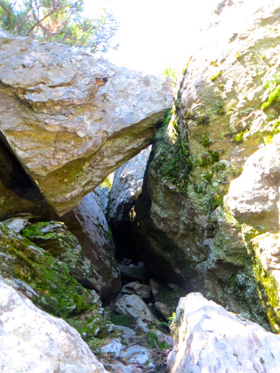 Boulder suspended over the trail